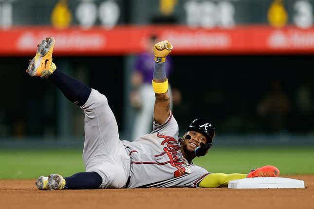 Aug 28, 2023; Denver, Colorado, USA; Atlanta Braves right fielder Ronald Acuna Jr. (13) reacts after stealing second in the seventh inning against the Colorado Rockies at Coors Field.