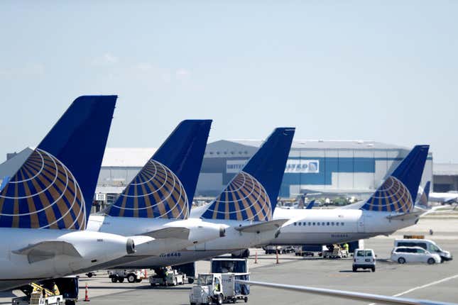 FILE - United Airlines jets sit at a gate at Terminal C of Newark Liberty International Airport in Newark, N.J., July 18, 2018. Passengers on a United Airlines jet from Newark, N.J. to Rome, got a steep ride to a lower altitude after pilots suspected a possible loss of cabin pressure, Thursday morning, Sept. 14, 2023. The flight turned around less than an hour into the flight and returned to Newark. (AP Photo/Julio Cortez, File)