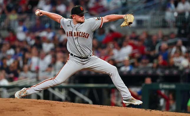 Aug 19, 2023; Cumberland, Georgia, USA; San Francisco Giants starting pitcher Logan Webb (62) pitching against the Atlanta Braves during the fourth inning at Truist Park.