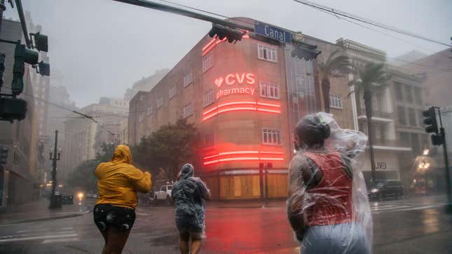 A group of people cross an intersection during Hurricane Ida on August 29, 2021 in New Orleans, Louisiana.