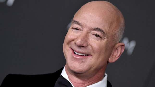 close-up photo of jeff bezos wearing a tuxedo standing in front of a gray backdrop at a gala event in 2021.