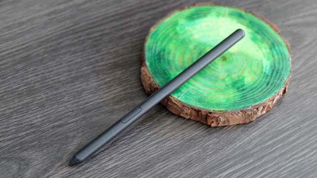 A photo of the S Pen standalone stylus laid across a green marbly coaster