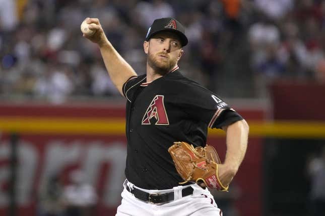 May 28, 2023; Phoenix, Arizona, USA; Arizona Diamondbacks starting pitcher Merrill Kelly (29) throws against the Boston Red Sox in the first inning at Chase Field.
