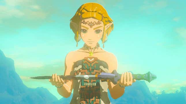 Zelda holds up the Master Sword. 