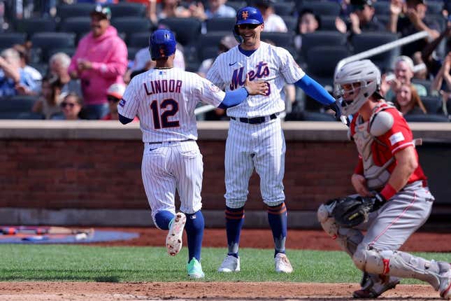 Sep 17, 2023; New York City, New York, USA; New York Mets shortstop Francisco Lindor (12) and designated hitter Brandon Nimmo (9) celebrate after scoring on a double by catcher Francisco Alvarez (not pictured) during the third inning against the Cincinnati Reds at Citi Field.