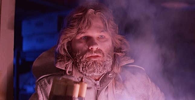 A scared kurt russell in pink light and snow