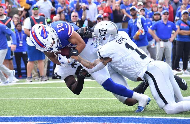 Sep 17, 2023; Orchard Park, New York, USA; Buffalo Bills wide receiver Khalil Shakir (10) scores a touchdown as he is tackled by Las Vegas Raiders safety Marcus Epps (1) in the second quarter at Highmark Stadium.