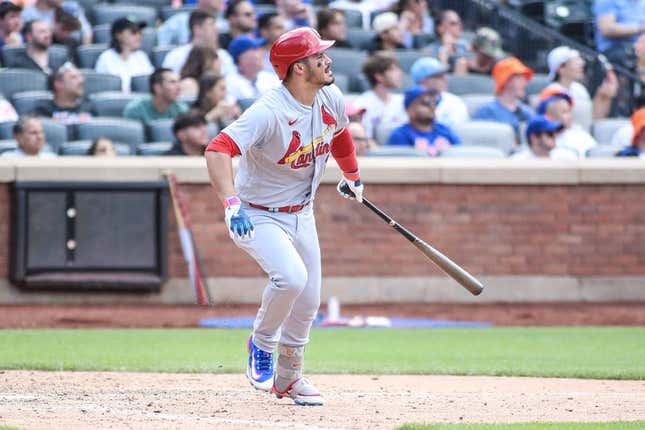 Jun 18, 2023; New York City, New York, USA;  St. Louis Cardinals third baseman Nolan Arenado (28) hits a solo hime run in the ninth inning against the New York Mets at Citi Field.