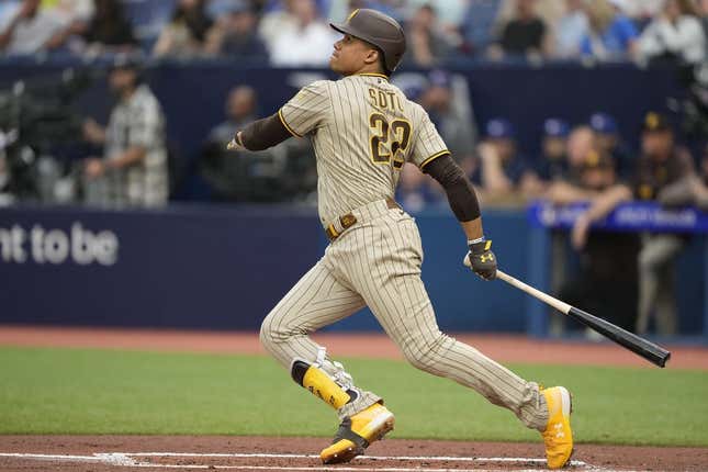 Jul 18, 2023; Toronto, Ontario, CAN;  San Diego Padres left fielder Juan Soto (22) hits a two run home run against the Toronto Blue Jays during the first inning at Rogers Centre.