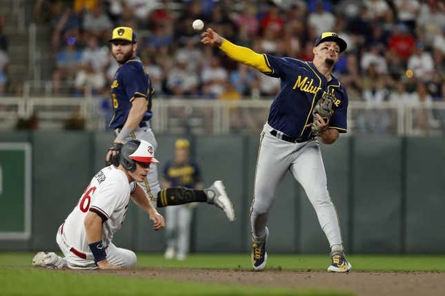 Jun 13, 2023; Minneapolis, Minnesota, USA; Milwaukee Brewers second baseman Luis Urias (2) forces out Minnesota Twins pinch hitter Max Kepler (26) but cannot turn the double play in the eighth inning at Target Field.