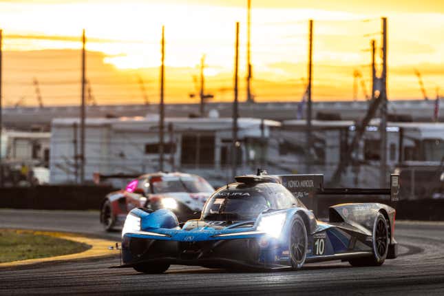 The No. 10 Wayne Taylor Racing Acura at dusk Saturday of the Rolex 24 at Daytona.