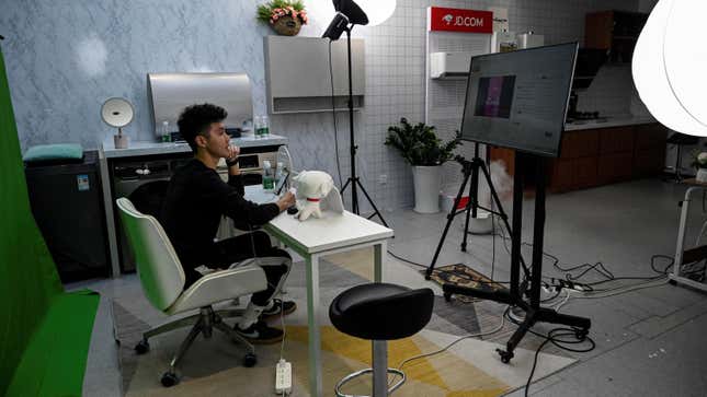 A livestreamer sells products at a JD outsourcing livestream company in Beijing, China on November 9, 2021.