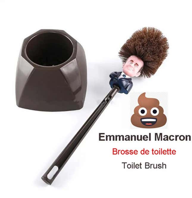 A toilet brush with Emmanuel Macron's head on it.