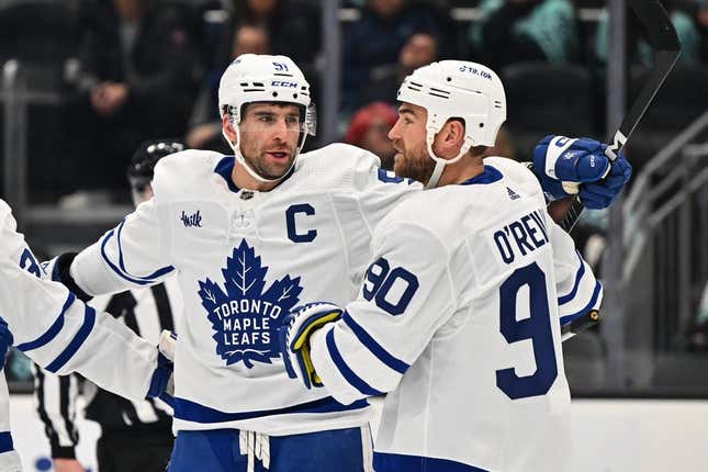 Feb 26, 2023; Seattle, Washington, USA; Toronto Maple Leafs center John Tavares (91) and Toronto Maple Leafs center Ryan O&#39;Reilly (90) celebrate after Tavares scored a goal against the Seattle Kraken during the first period at Climate Pledge Arena.