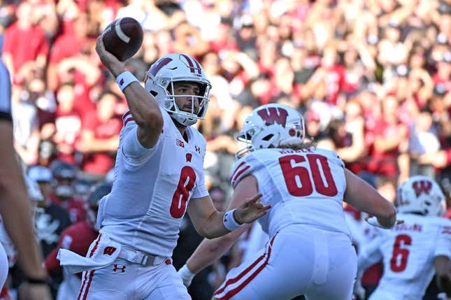 Sep 9, 2023; Pullman, Washington, USA; Wisconsin Badgers quarterback Tanner Mordecai (8) throws a pass against the Washington State Cougars in the first half at Gesa Field at Martin Stadium.