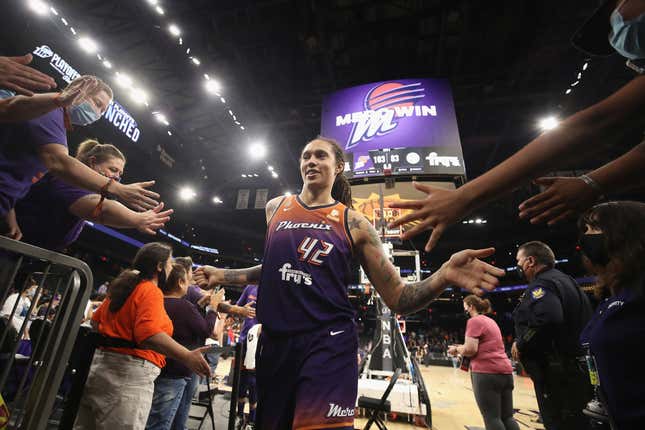 Brittney Griner #42 of the Phoenix Mercury high fives fans following the WNBA game against the Chicago Sky at the Footprint Center on August 31, 2021 in Phoenix, Arizona. The Mercury defeated the Sky 103-83.