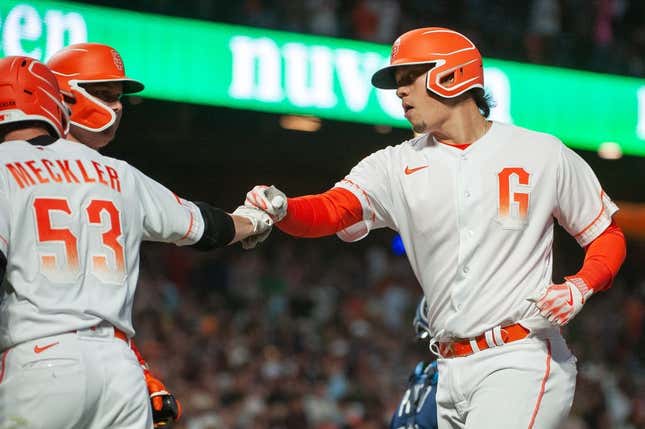 Aug 15, 2023; San Francisco, California, USA;  San Francisco Giants third baseman Wilmer Flores (41) celebrates with right fielder Wade Meckler (53) after hitting a home run during the sixth inning against the Tampa Bay Rays at Oracle Park.