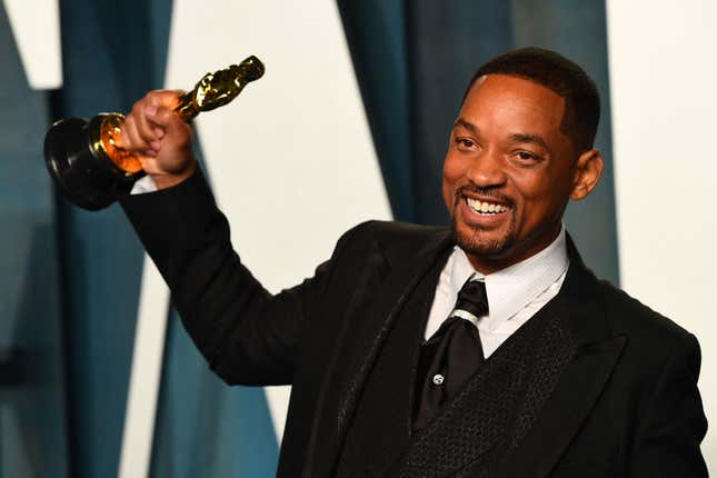 Will Smith holds his award for Best Actor in a Leading Role for “King Richard” as he attends the 2022 Vanity Fair Oscar Party in Beverly Hills, California on March 27, 2022.