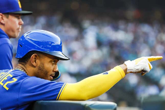 Aug 25, 2023; Seattle, Washington, USA; Seattle Mariners center fielder Julio Rodriguez (44) celebrates in the dugout after scoring a run against the Kansas City Royals during the first inning at T-Mobile Park.