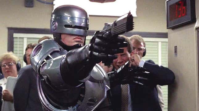 RoboCop firing his weapon.