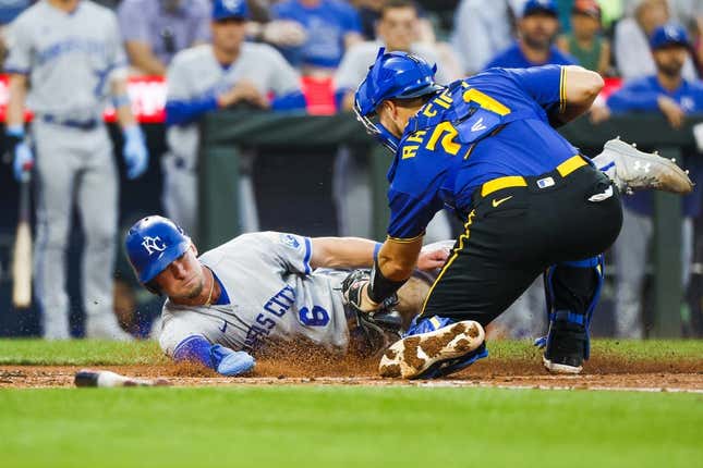 Aug 25, 2023; Seattle, Washington, USA; Seattle Mariners catcher Cal Raleigh (29) tags out Kansas City Royals center fielder Drew Waters (6) during the second inning at T-Mobile Park.