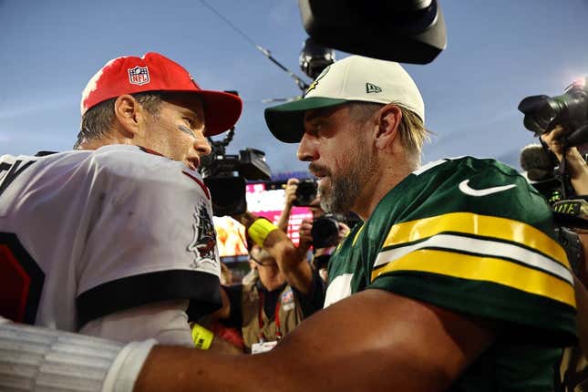 Sep 25, 2022; Tampa, Florida, USA; Tampa Bay Buccaneers quarterback Tom Brady (12) and Green Bay Packers quarterback Aaron Rodgers (12) greet after the game at Raymond James Stadium.