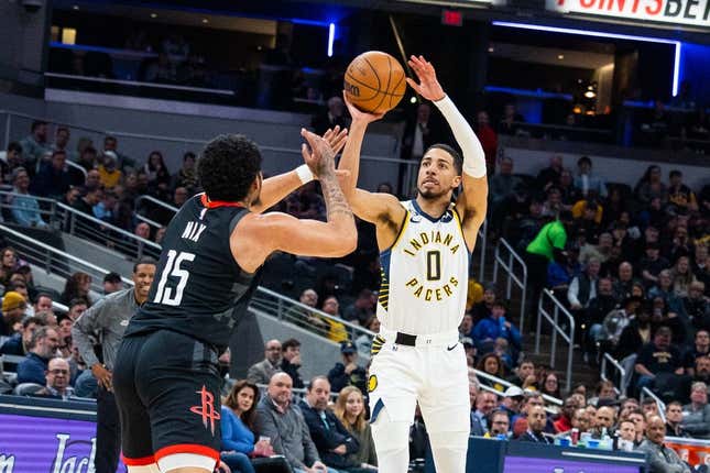 Mar 9, 2023; Indianapolis, Indiana, USA; Indiana Pacers guard Tyrese Haliburton (0) shoots the ball while Houston Rockets guard Daishen Nix (15) defends in the second quarter at Gainbridge Fieldhouse.