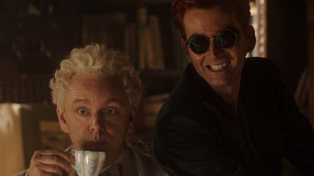 In a promo photo for Good Omens season two, Michael Sheen holds a tea cup as the angel Aziraphale and David Tennant wears dark sunglasses as the demon Crowley