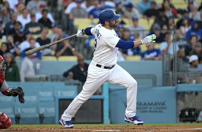 Jul 7, 2023; Los Angeles, California, USA; Los Angeles Dodgers designated hitter J.D. Martinez (28) hits a solo home run in the second inning against the Los Angeles Angels at Dodger Stadium.