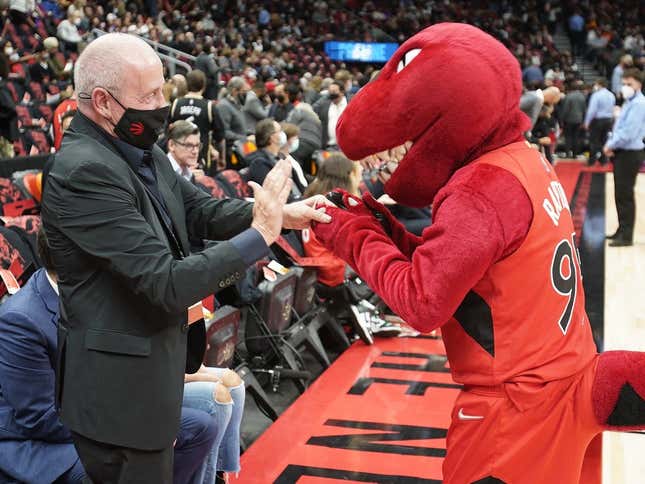 Oct 20, 2021; Toronto, Ontario, CAN; Maple Leaf Sports and Entertainment chairman Larry Tanenbaum (left) greets the Toronto Raptors mascot before the home opener against the Washington Wizards at Scotiabank Arena.