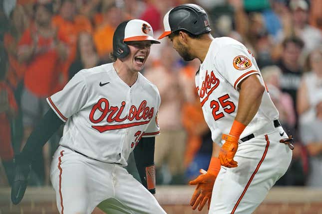 Aug 24, 2023; Baltimore, Maryland, USA; Baltimore Orioles outfielder Anthony Santander (25) greeted by catcher Adley Rutschman (35) following his two run home run in the fourth inning against the Toronto Blue Jays at Oriole Park at Camden Yards.