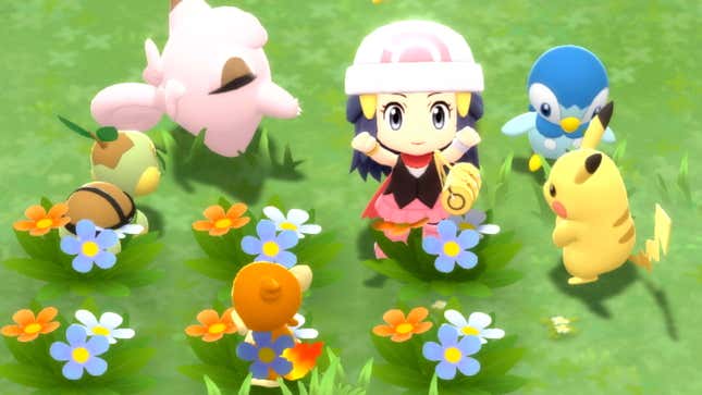 A Pokemon character surrounded by Pokemon in green grass with pretty little flowers.