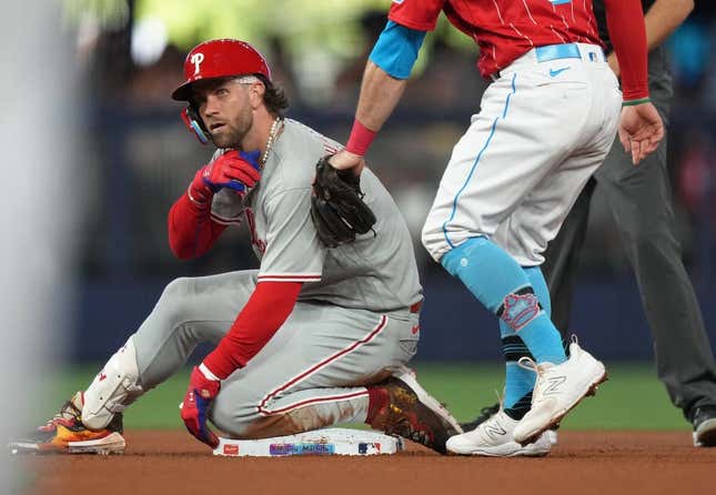 Jul 8, 2023; Miami, Florida, USA;  Philadelphia Phillies designated hitter Bryce Harper (3) takes a moment after hitting a double in the second inning against the Miami Marlins at loanDepot Park.