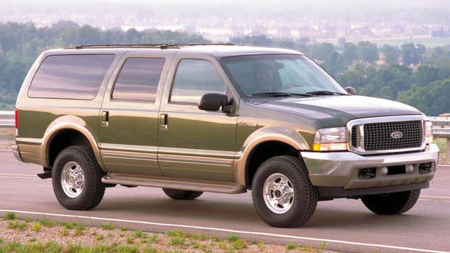 A photo green Ford Excursion truck. 