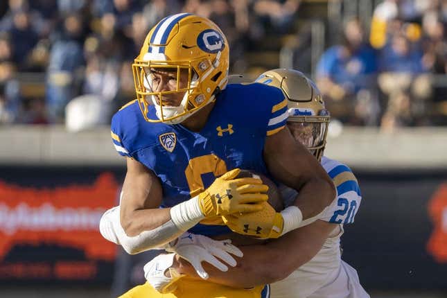 November 25, 2022; Berkeley, California, USA; California Golden Bears running back Jaydn Ott (6) is tackled by UCLA Bruins linebacker Kain Medrano (20) during the second quarter at California Memorial Stadium.