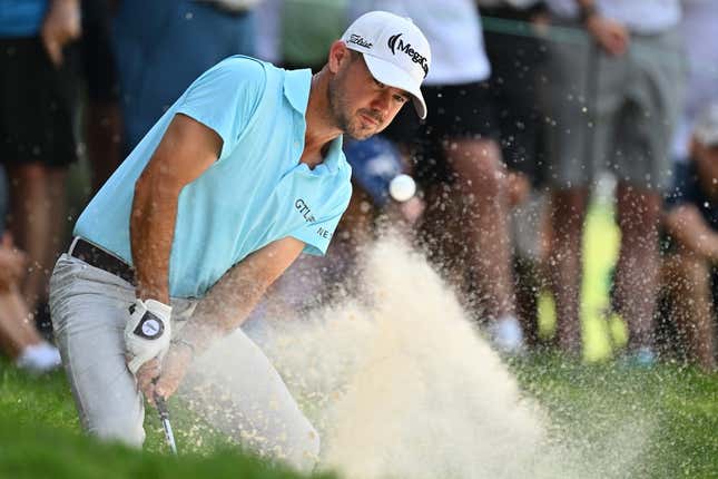 Aug 20, 2023; Olympia Fields, Illinois, USA; Brian Harman hits out of a bunker on the 2nd green during the final round of the BMW Championship golf tournament.