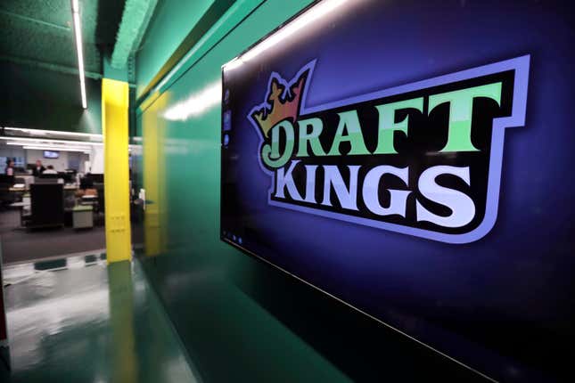 FILE - The DraftKings logo is displayed at the sports betting company headquarters, May 2, 2019, in Boston. DraftKings apologized Monday, Sept. 11, 2023, after using the Sept. 11, 2001, terror attacks to entice people to bet on baseball and football games on the anniversary of the tragedy that killed nearly 3,000 people. (AP Photo/Charles Krupa, File)