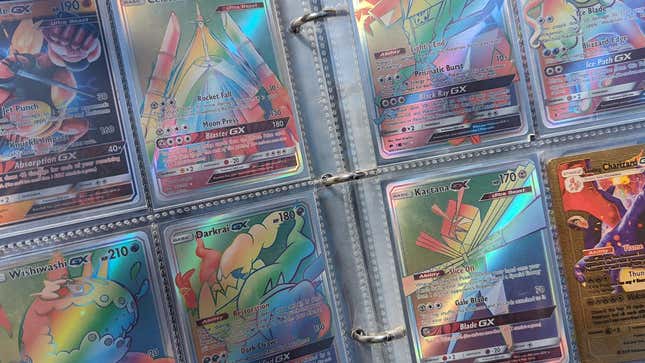A photograph from my son's Pokemon card binder, showing a bunch of rainbow rares and what I'm pretty sure is a fake ultra rare Charizard GX.