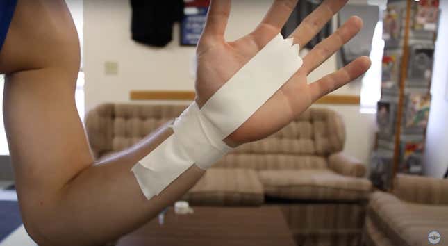 hand with athletic tape on it, in a configuration we describe in the article