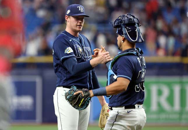 Aug 8, 2023; St. Petersburg, Florida, USA; Tampa Bay Rays relief pitcher Pete Fairbanks (29) and catcher Rene Pinto (50) high five as they beat the St. Louis Cardinals at Tropicana Field.