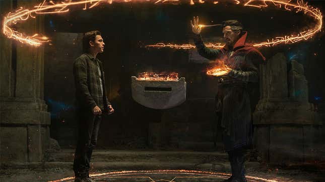 Peter Parker talks to Doctor Strange as he casts a large, glowing circle of magical runes from his hands in Spider-Man: No Way Home