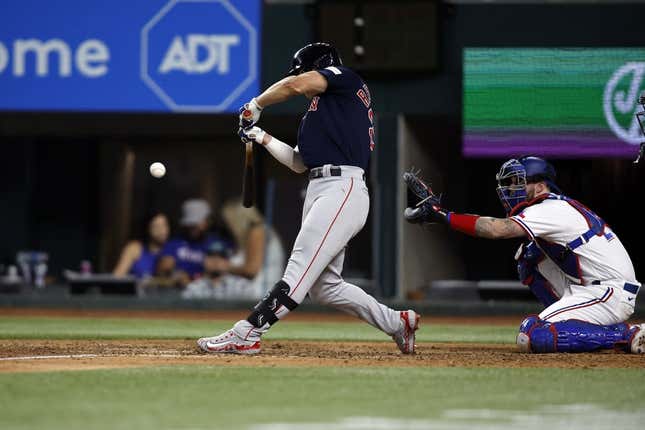 Sep 18, 2023; Arlington, Texas, USA; Boston Red Sox left fielder Rob Refsnyder (30) hits a two run single in the eighth inning against the Texas Rangers at Globe Life Field.