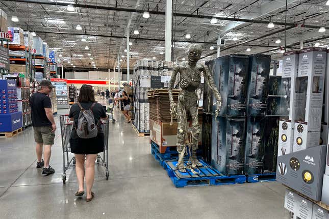 Shoppers pass a display of Halloween goods in a Costco warehouse Friday, Aug. 4, 2023, in Thornton, Colo. On Thursday, the Commerce Department issues its July report on consumer spending. (AP Photo/David Zalubowski)