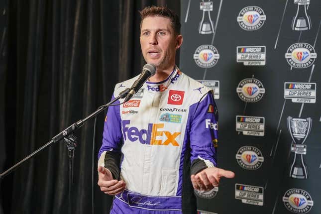 Aug 31, 2023; Charlotte, North Carolina, USA; Denny Hamlin answers questions from the media at Charlotte Convention Center.