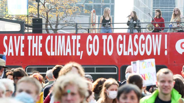 People participate in a climate march in Brussels, ahead of the COP26 climate summit in Glasgow in November.