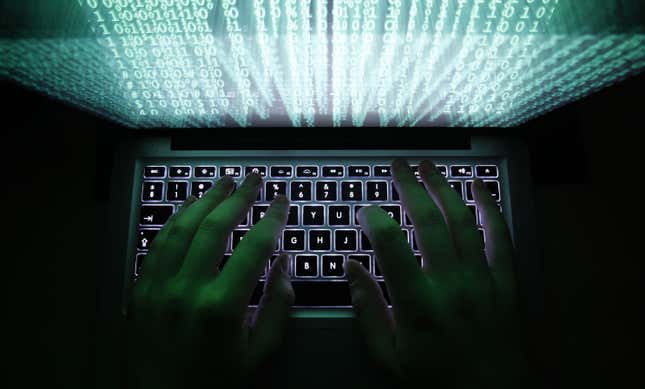 A man types on a computer keyboard in Warsaw in this February 28, 2013 illustration file picture. One of the largest ever cyber attacks is slowing global internet services after an organisation blocking "spam" content became a target, with some experts saying the disruption could get worse.