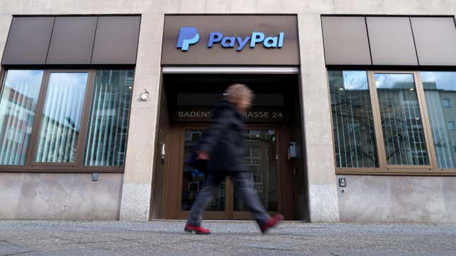 A woman walks in front of PayPal's office building