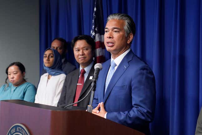 California Attorney General Rob Bonta, right, discusses the rise in hate crimes in California, at a news conference in Sacramento, Calif., Tuesday, June 28, 2022. Bonta said hate crimes in 2021 shot up 33% to nearly 1,800 reported incidents. That is the sixth highest tally on record and the highest since after the 9/11 terrorist attack in 2001.
