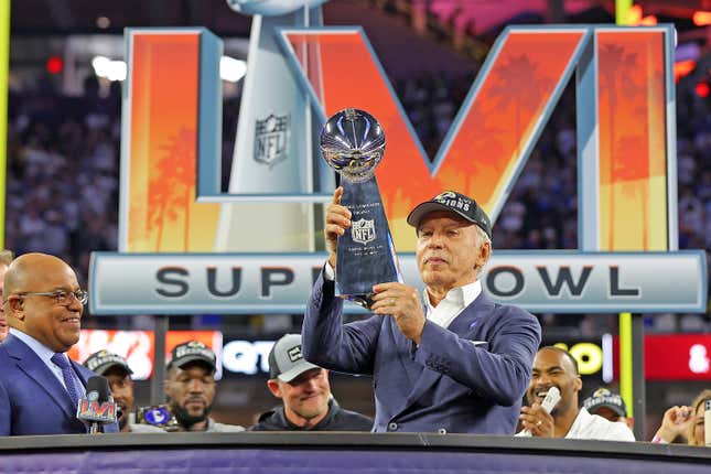 Los Angeles Rams owner Stan Kroenke holds up the Lombardi trophy