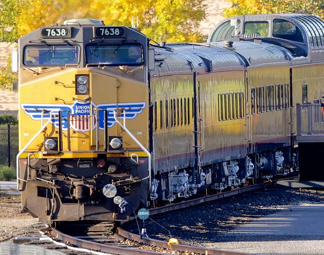 FILE - A Union Pacific locomotive with passenger cars in tow is parked, Oct. 17, 2013, in Omaha, Neb. Union Pacific&#39;s new CEO Jim Vena, who came into the job in August 2023 with a reputation for cost-cutting, says he won&#39;t shy away from that but no one should expect the kind of sweeping changes he made when he first oversaw the railroad&#39;s operations a few years ago. (AP Photo/Nati Harnik, File)